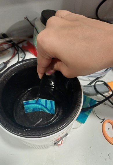Coating the paper strip with paraffin wax