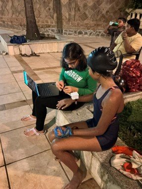 Swimmer testing the sweat sensor patch poolside